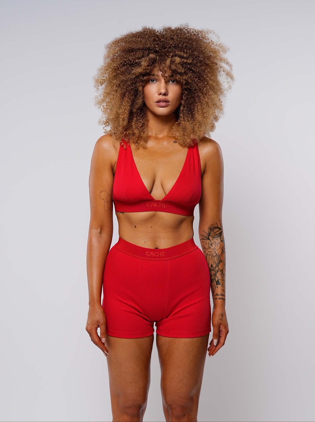 Woman wearing a red outfit on a white background