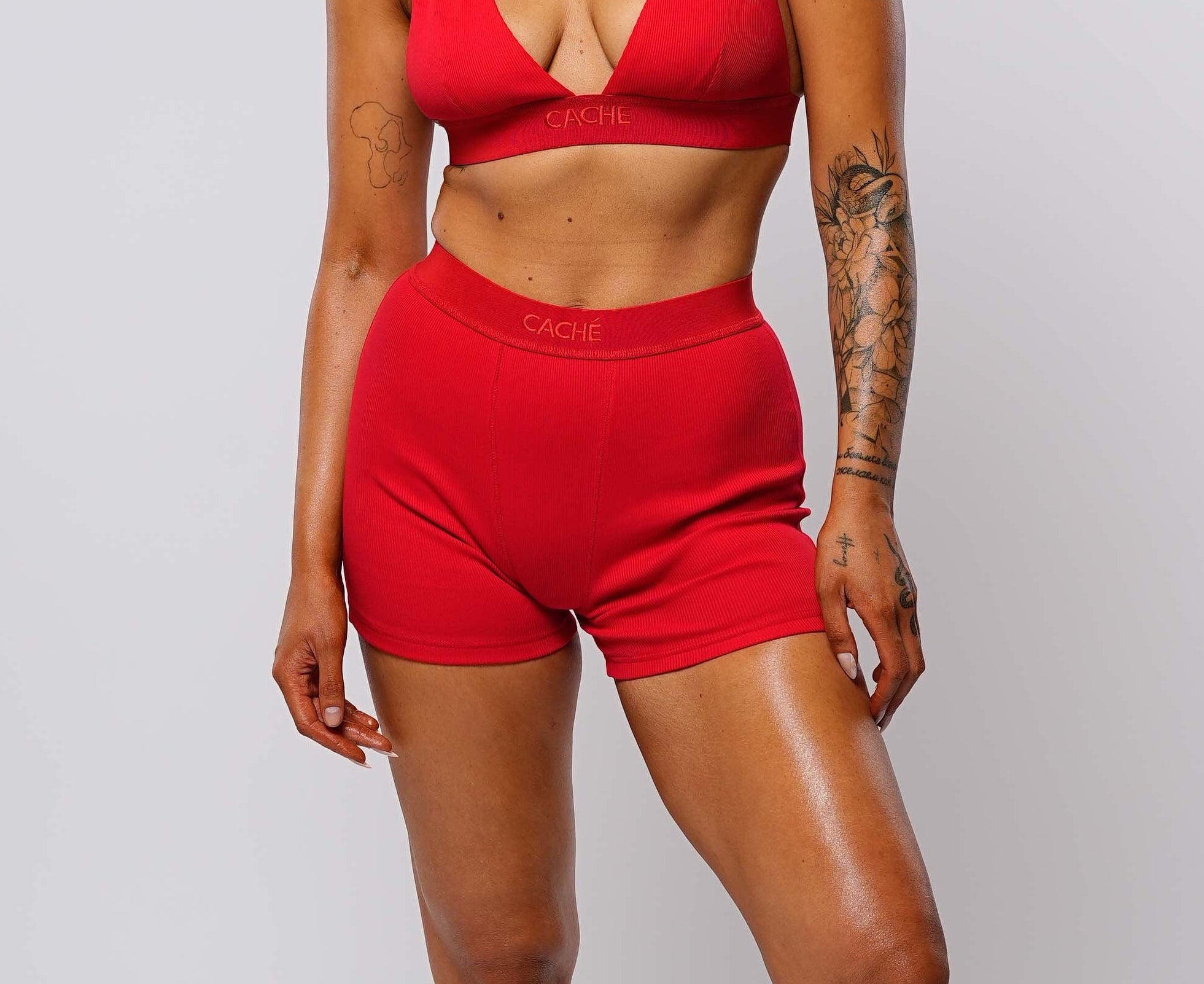 Woman wearing a red outfit with a white background